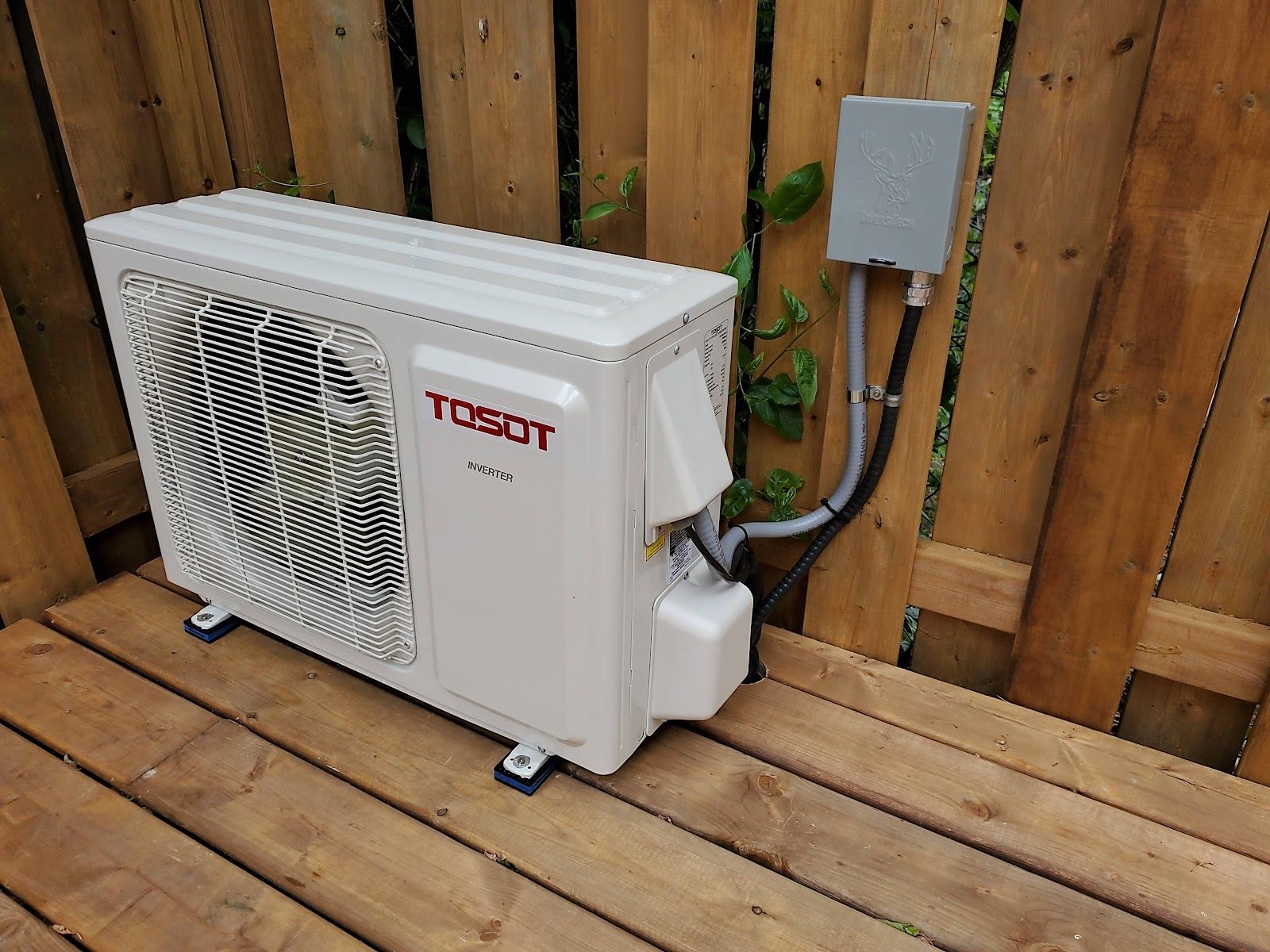 A Tosot mini-split outdoor unit on a deck