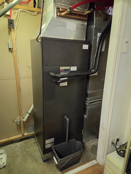 A Mitsubishi air handler installed in a utility room